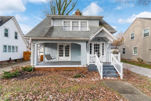 view of front property with french doors and a porch