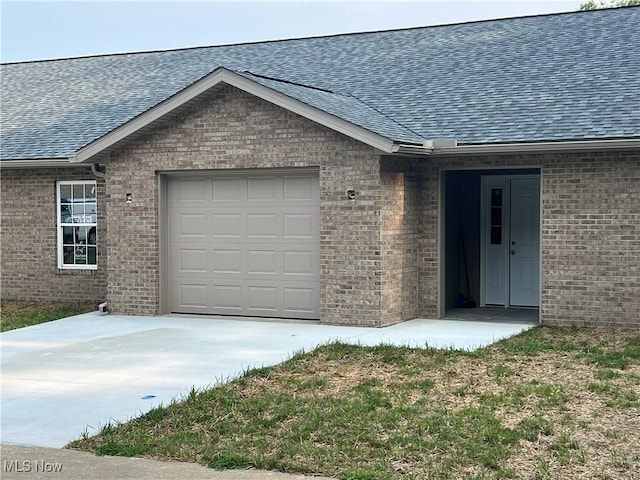 entrance to property featuring a garage