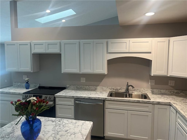 kitchen featuring sink, stainless steel appliances, light stone counters, and white cabinets