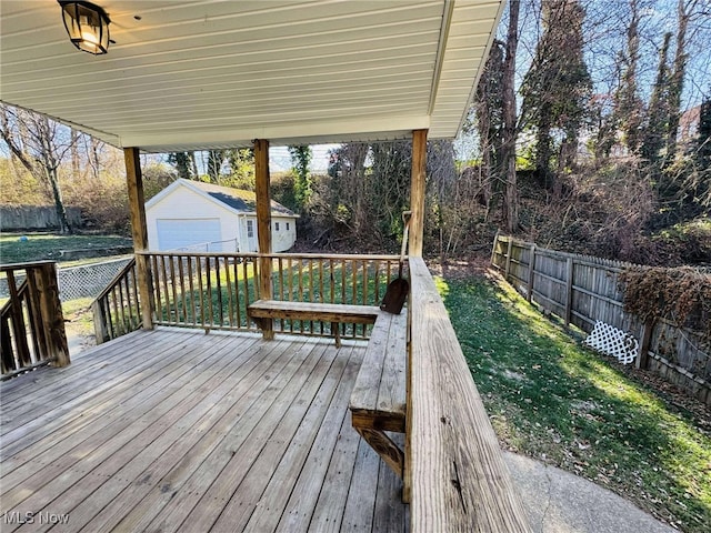 deck with an outbuilding and a lawn