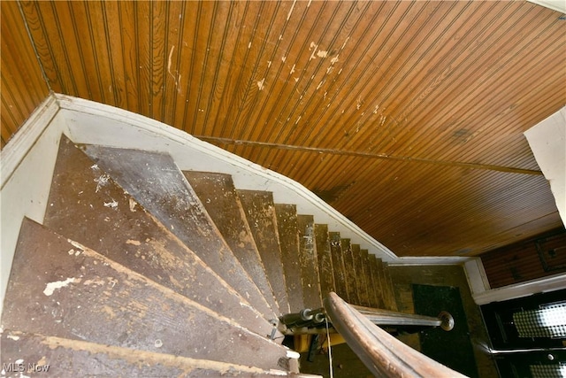 stairway featuring wooden ceiling