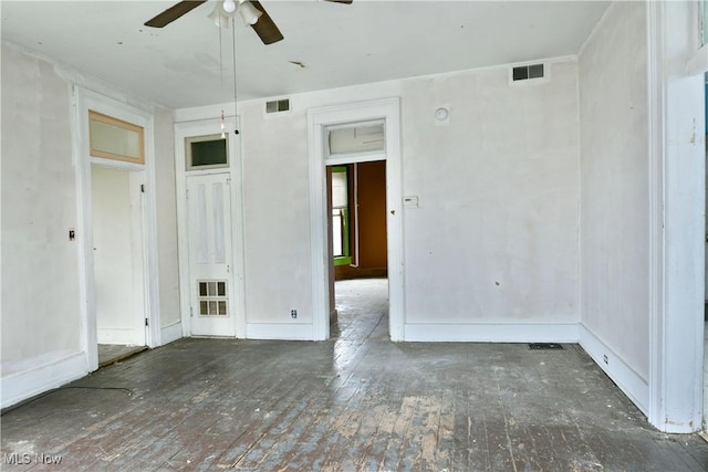 empty room featuring ceiling fan and hardwood / wood-style floors