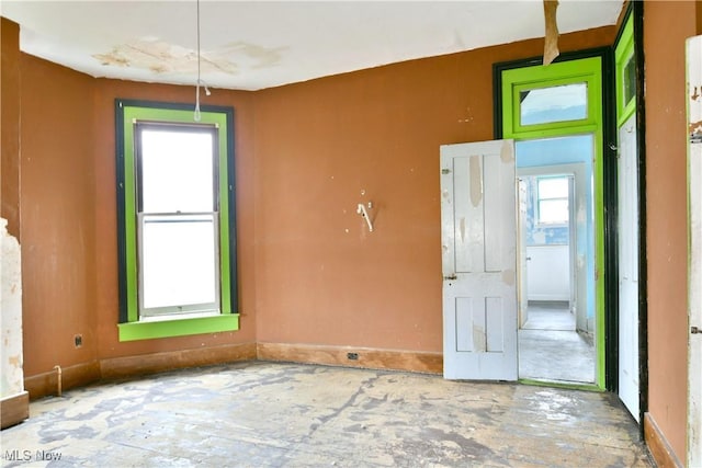 empty room featuring baseboards