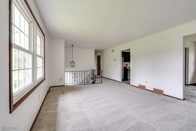 empty room featuring carpet flooring