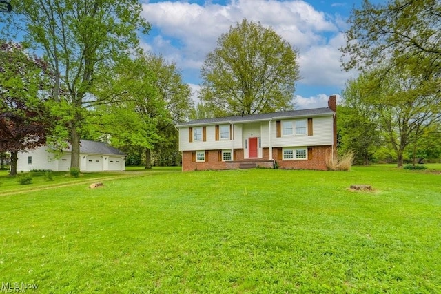 raised ranch featuring a front yard