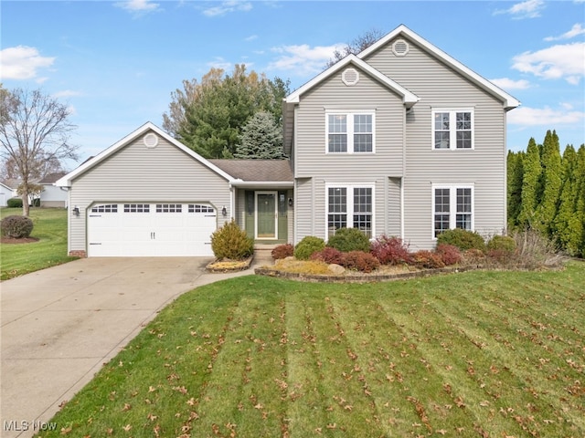 view of front of home featuring a garage and a front yard