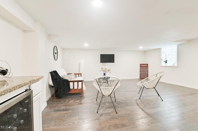 sitting room featuring beverage cooler and dark hardwood / wood-style floors