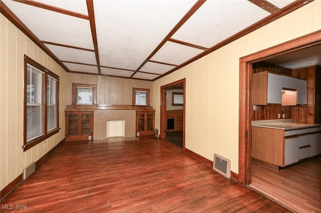 unfurnished room with dark wood-type flooring