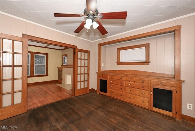 interior space with crown molding, french doors, ceiling fan, and dark hardwood / wood-style floors