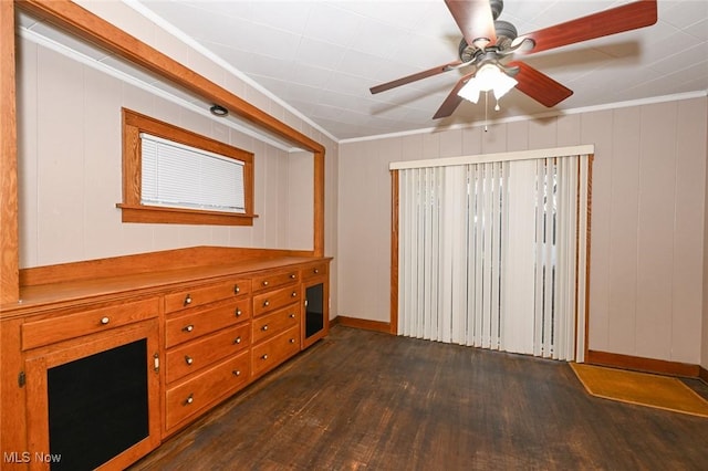 interior space with ceiling fan, crown molding, and dark wood-type flooring