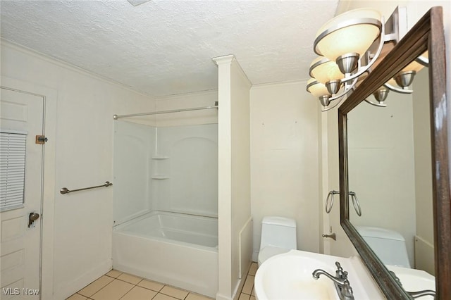 full bathroom with  shower combination, sink, tile patterned flooring, toilet, and a textured ceiling