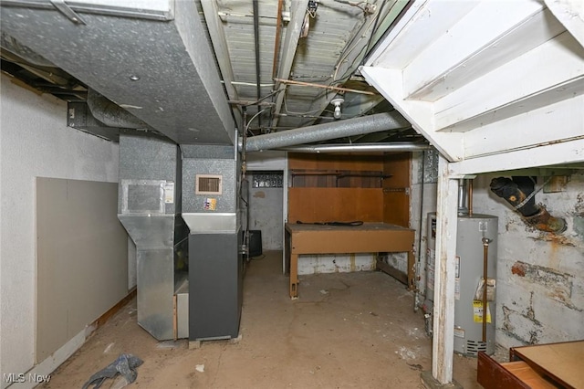 basement with gas water heater and heating unit