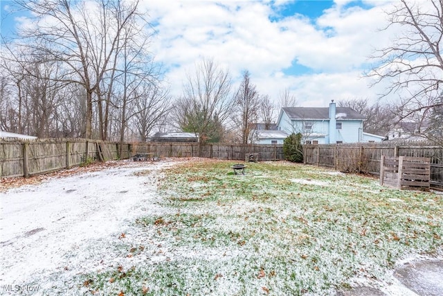 view of yard layered in snow