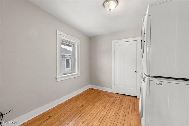 interior space featuring white cabinets, white fridge, and light hardwood / wood-style floors