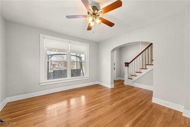 unfurnished room with ceiling fan and light hardwood / wood-style flooring