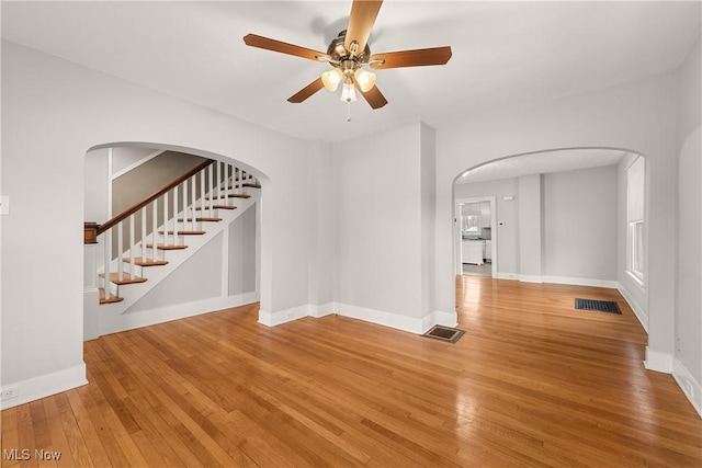 empty room featuring ceiling fan and wood-type flooring