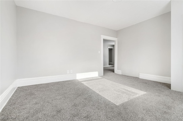 unfurnished room with carpet flooring