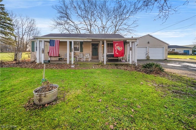 ranch-style house with an outdoor structure, a front yard, a porch, and a garage