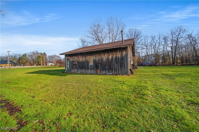 view of outdoor structure featuring a yard