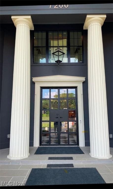 property entrance featuring french doors