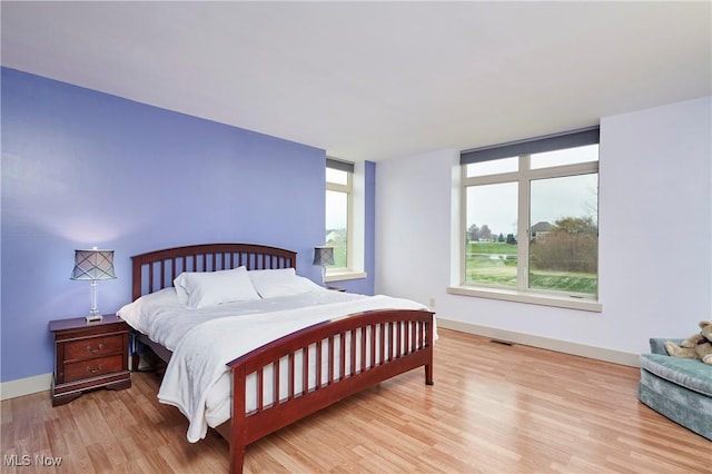 bedroom with light wood-type flooring