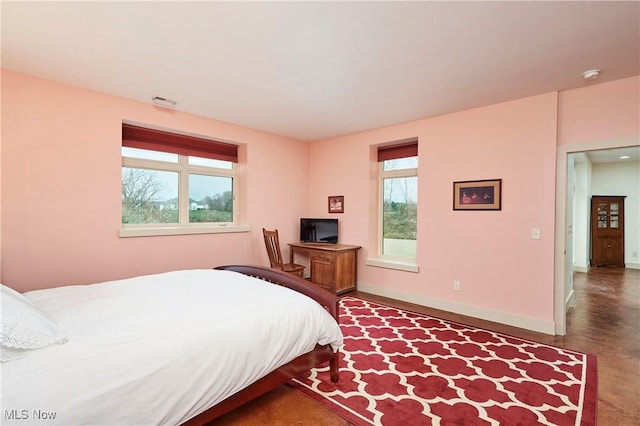 bedroom with multiple windows