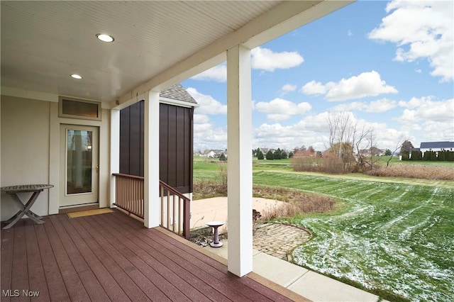 wooden deck with a lawn