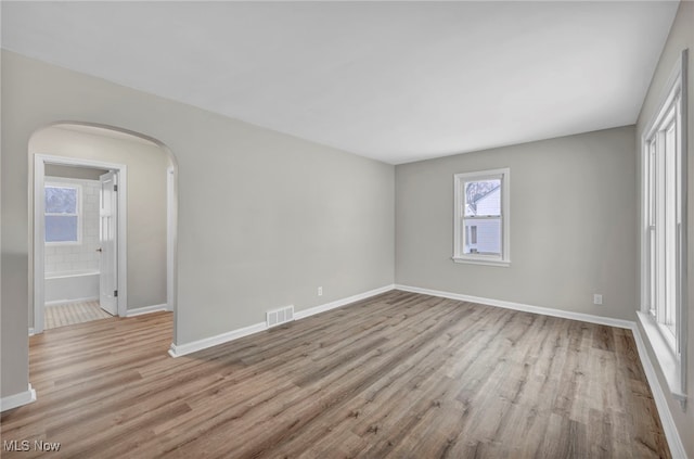 unfurnished room with light hardwood / wood-style flooring