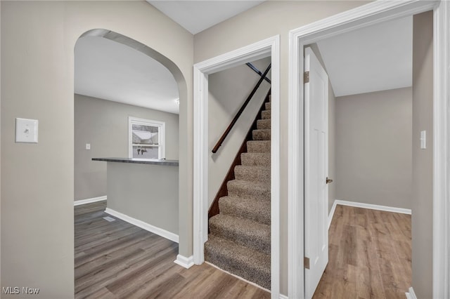 staircase featuring hardwood / wood-style floors