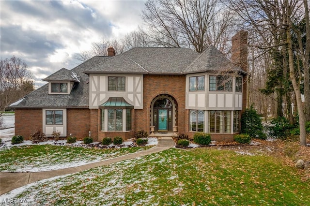 tudor house with a front yard