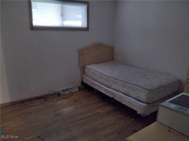 bedroom featuring dark wood-type flooring