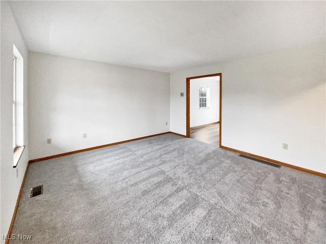 unfurnished room with carpet flooring