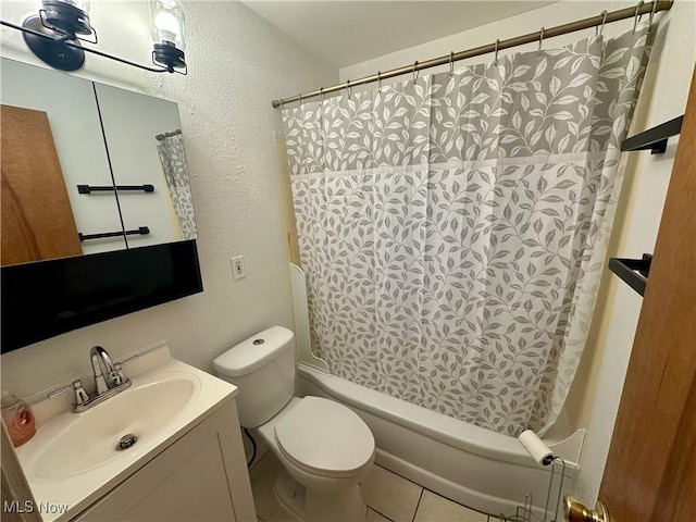 full bathroom featuring tile patterned flooring, vanity, shower / tub combo with curtain, and toilet