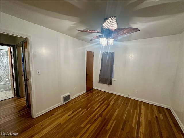 spare room with dark hardwood / wood-style floors