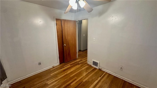 unfurnished room featuring ceiling fan and light wood-type flooring