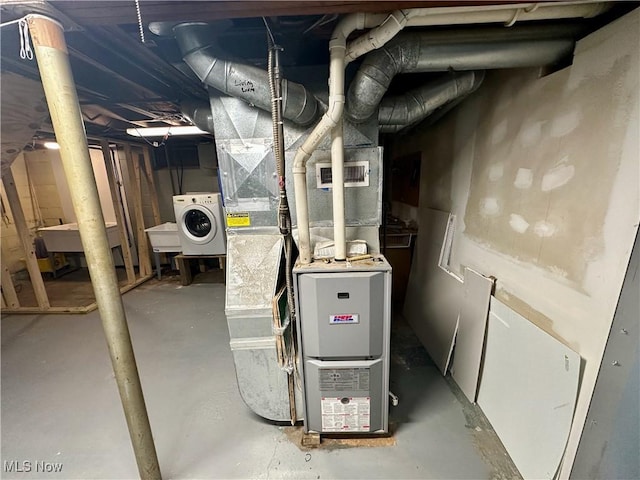 utility room featuring washer / dryer and sink