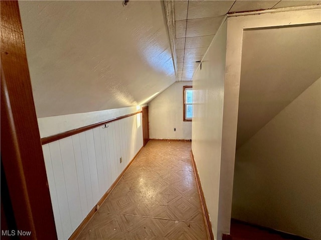 bonus room featuring lofted ceiling