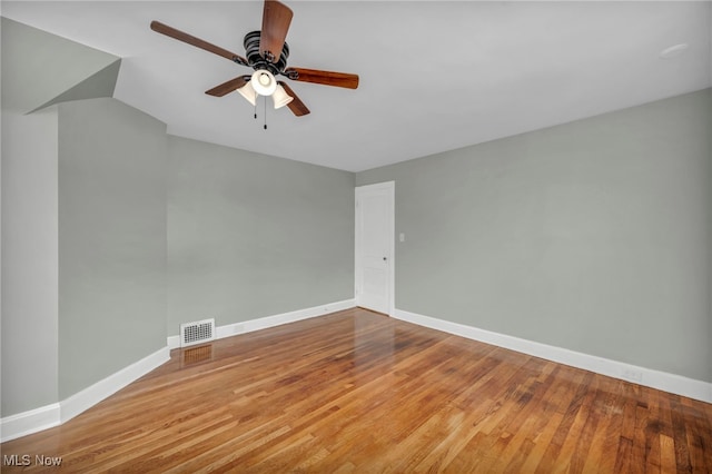 unfurnished room with ceiling fan and light wood-type flooring