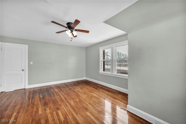 empty room featuring ceiling fan and wood-type flooring