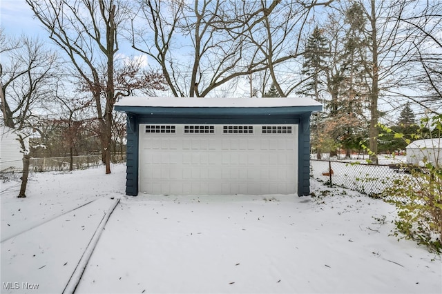 view of snow covered garage