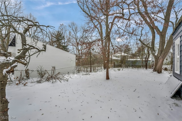 view of yard covered in snow