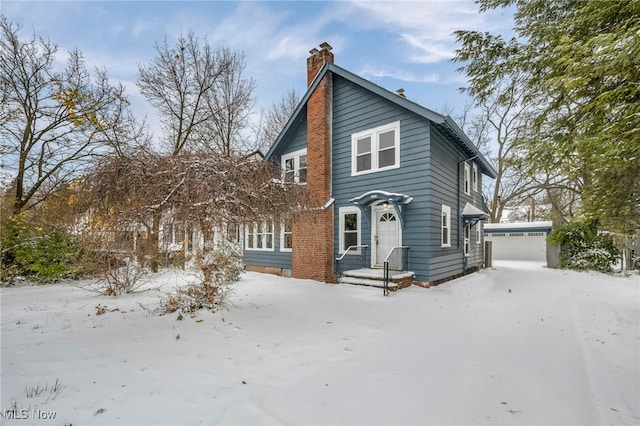 view of front of home featuring an outdoor structure and a garage