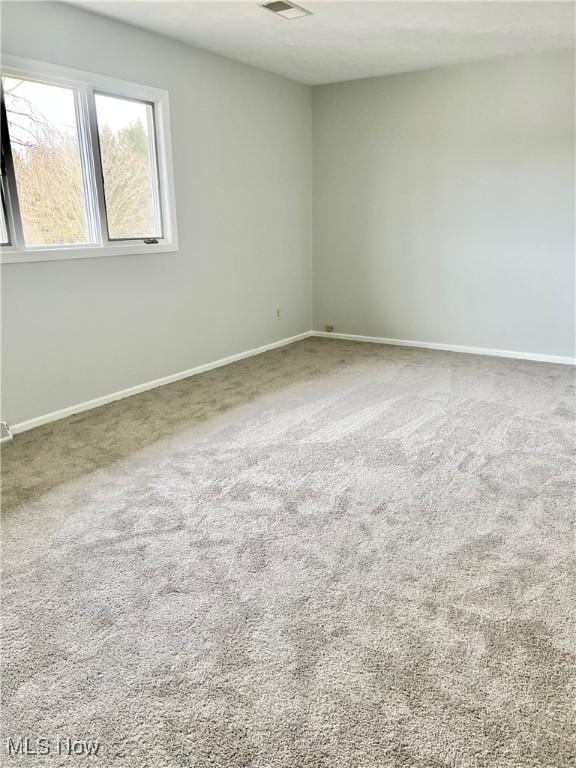 unfurnished room with carpet flooring