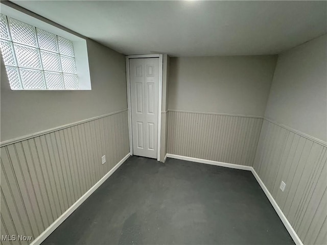 interior space featuring wood walls