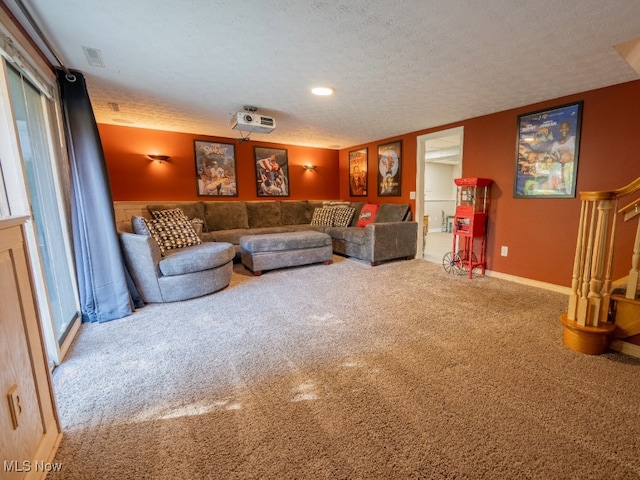 carpeted living room with a healthy amount of sunlight and a textured ceiling