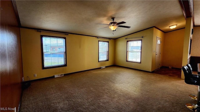 unfurnished room with carpet flooring, ceiling fan, crown molding, lofted ceiling, and a textured ceiling