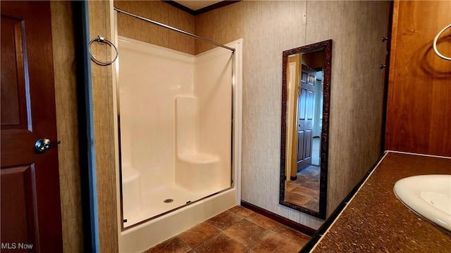 bathroom with tile patterned flooring, vanity, and an enclosed shower