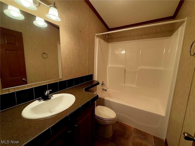 full bathroom featuring vanity, decorative backsplash, toilet, ornamental molding, and shower / bathtub combination