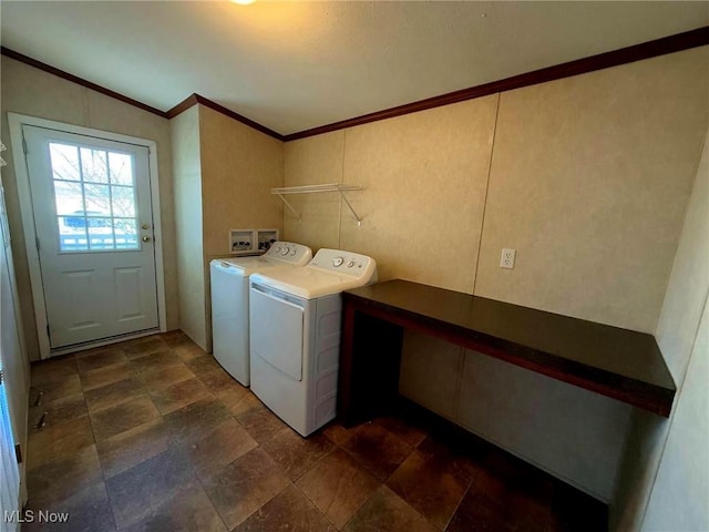 laundry area with independent washer and dryer and ornamental molding