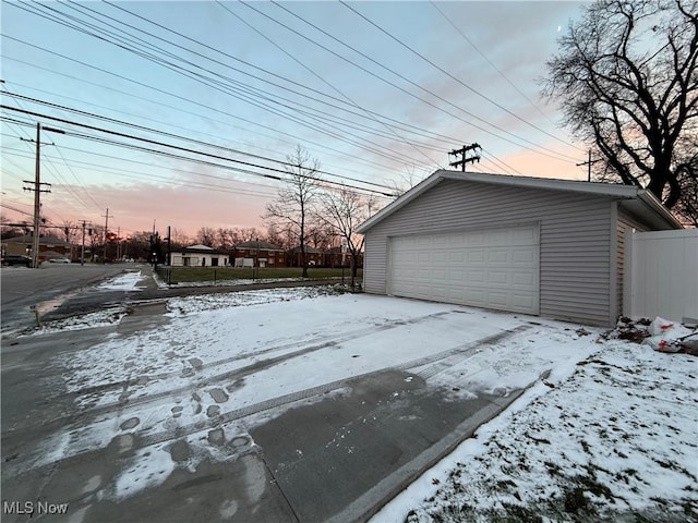 view of snow covered garage